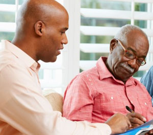 two people filling out paperwork