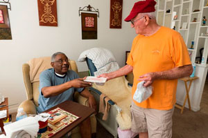 man handing out meal