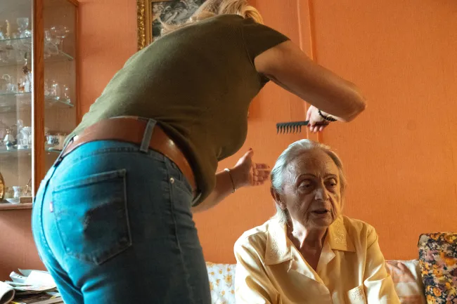 caregiver combing hair